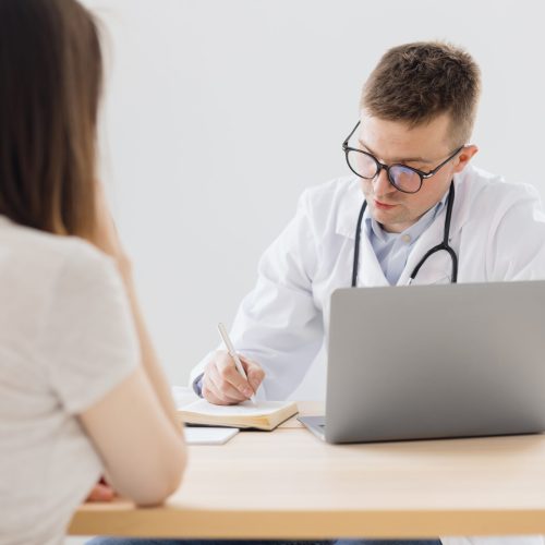 a-european-male-doctor-sees-the-patient-in-his-off-2026-03-19-08-13-52-utc